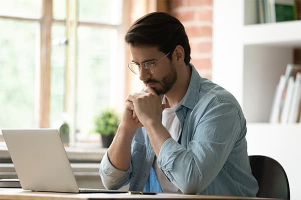 https://tower.10bestpayrollsoftware.com/wp-content/uploads/2024/01/Pensive-Caucasian-male-employee-look-at-laptop-screen-work-on-gadget-thinking-pondering..jpg